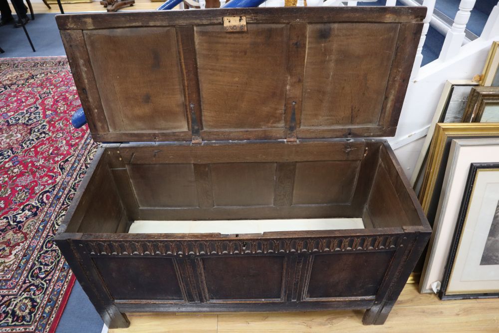 An 18th century oak panelled coffer, width 128cm, depth 52cm, height 66cm